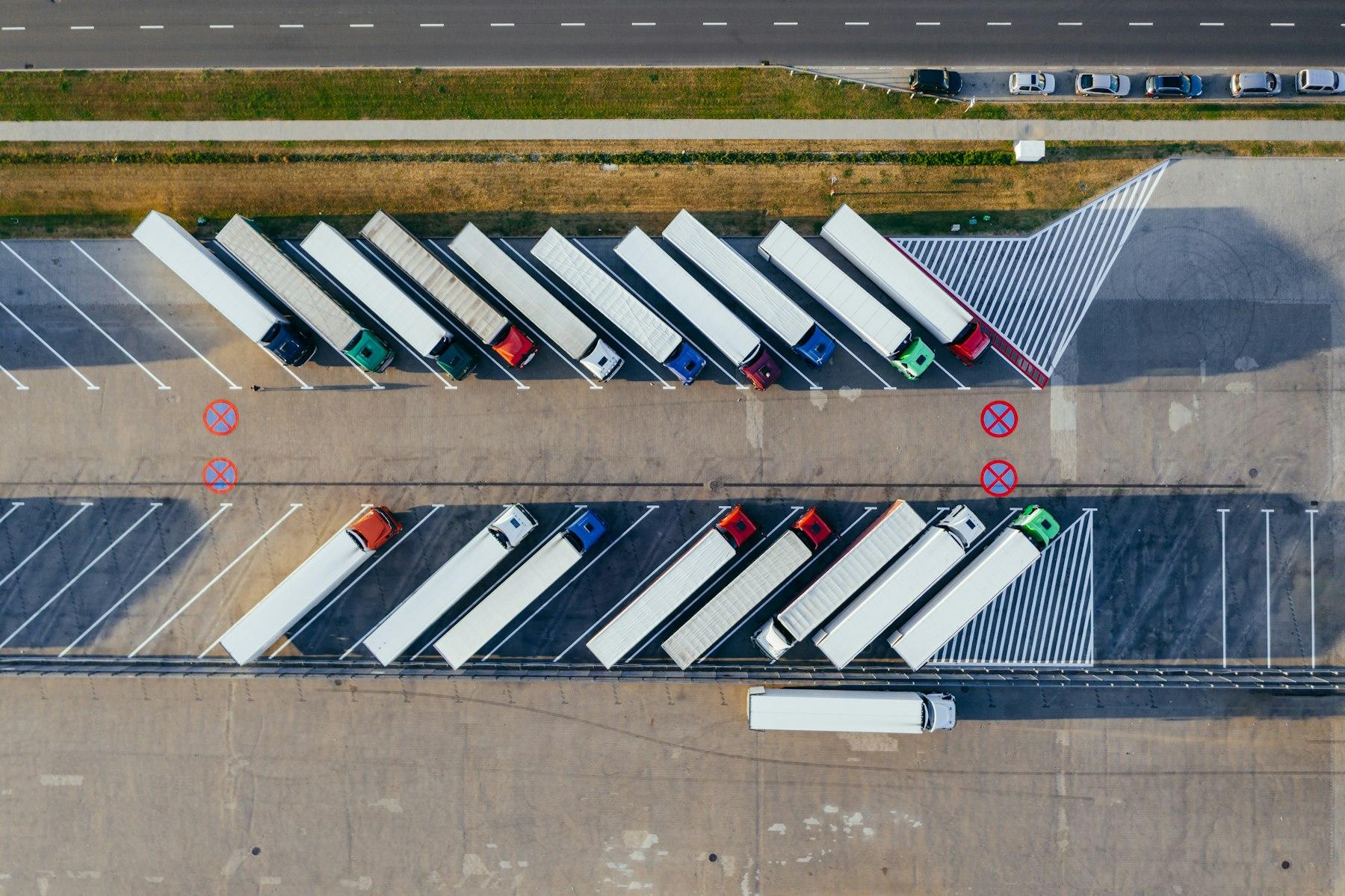 Aerial view of freight trucks parked at a distribution yard