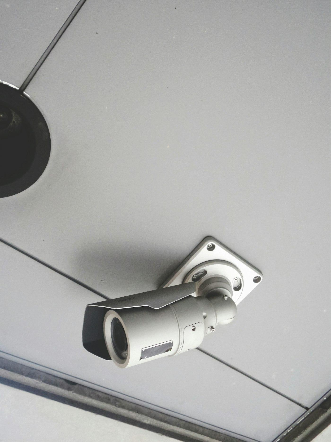 Bullet-style CCTV camera mounted on a wall